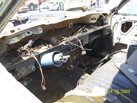 1972 Ford Ranchero - The interior of a 1972 Ford Ranchero shows significant disrepair with exposed wiring and rust.