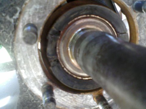 1986 Ford Bronco - This is a close-up view of a vehicle's wheel bearing assembly, showing wear and tear.