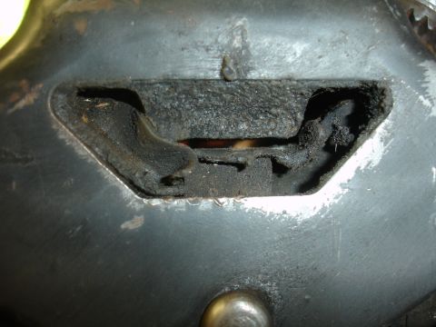 1995 Ford Taurus - This part appears to be a worn-out engine or transmission mount with visible damage to the rubber.