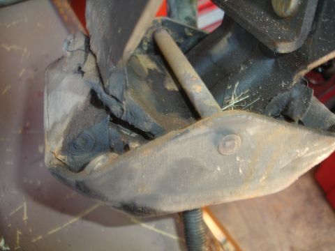 1995 Ford Taurus - This engine mount shows significant wear and tear, with visible cracks and degradation of the rubber components.