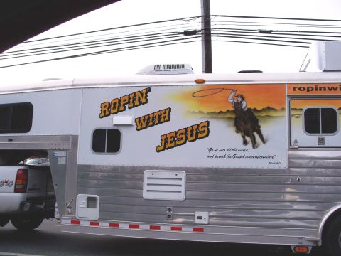 1971 Ford Ranchero - A white horse trailer is decorated with a mural of a cowboy on a horse and the text 'Ropin with Jesus'.