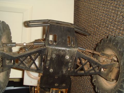 1992 Ford Bronco - Close-up of a remote control car's chassis, detailing its suspension and mechanical parts.