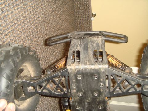 1992 Ford Bronco - Close-up view of the undercarriage and suspension system of a remote-controlled vehicle.
