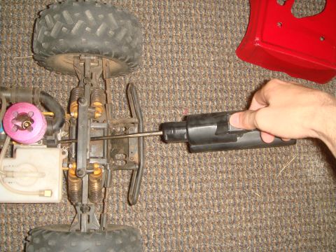 1992 Ford Bronco - A remote control car chassis is shown with its engine and suspension components.