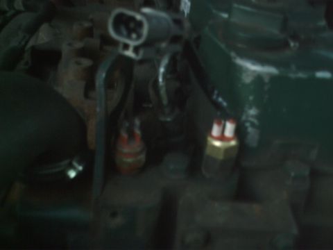 1989 Ford Bronco - Engine bay detail showing various sensors and wiring harnesses.