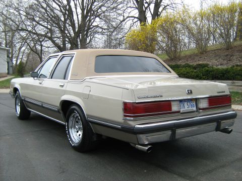1988 Mercury Grand Marquis - This 1988 Mercury Grand Marquis has a tan vinyl roof and chrome trim details.