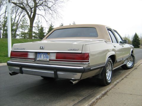 1988 Mercury Grand Marquis - This 1988 Mercury Grand Marquis is shown from the rear, its distinctive taillights and chrome exhaust tips.