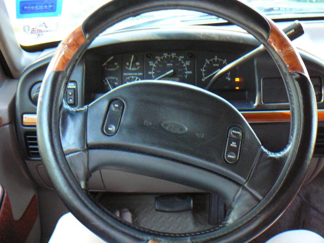 1992 Ford Bronco interior showing steering wheel, dashboard, and gauges