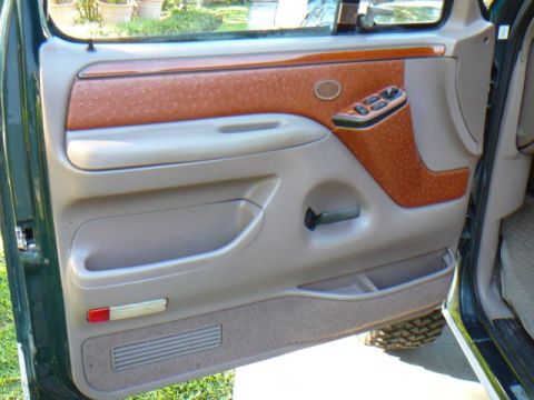 1992 Ford Bronco - Interior door panel details show textured trim and storage compartments.