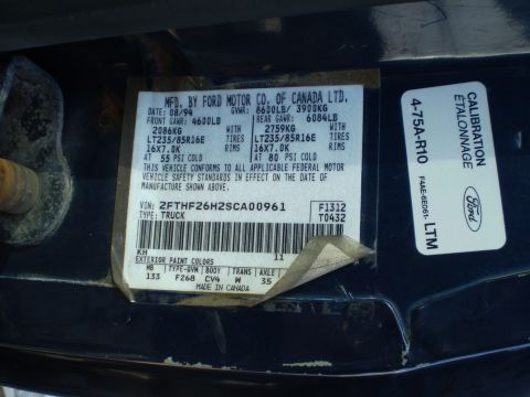 1995 Ford F-150 - Vehicle identification label shows manufacturing date of August 1994.