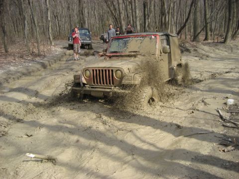 1991 Ford Bronco - Off-roading adventure turns into a muddy challenge for a Jeep Wrangler.