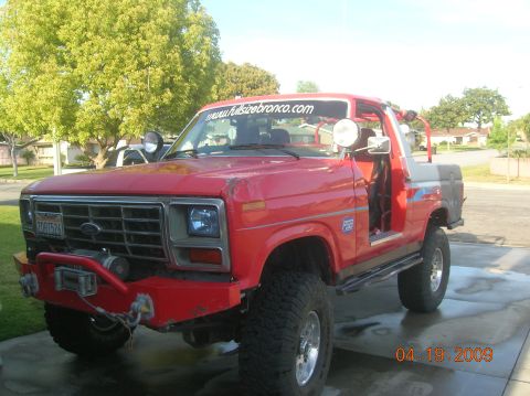 1985 Ford Bronco - This modified Ford Bronco is parked in a driveway on a sunny day. The date stamp on the photo reads 04.19.2009.