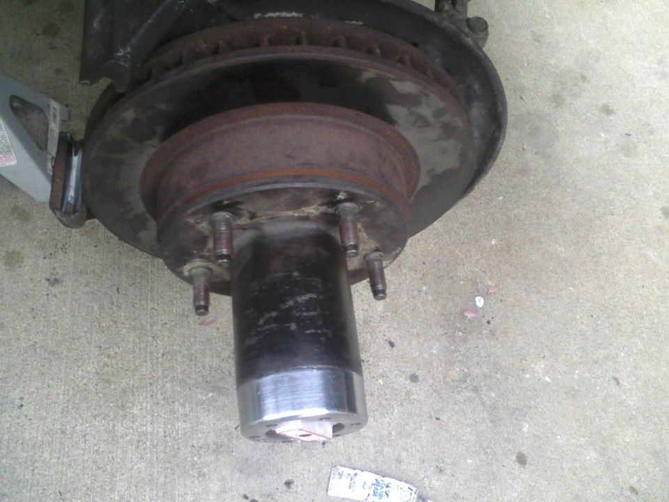 Vehicle brake rotor and hub assembly with lug studs visible