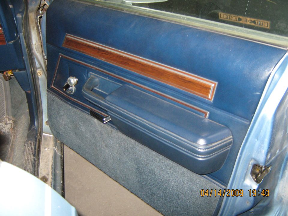 1985 Ford LTD interior door panel with blue vinyl and wood trim