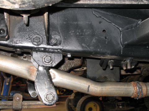1985 Ford Bronco - Close-up view of the exhaust system and frame components.