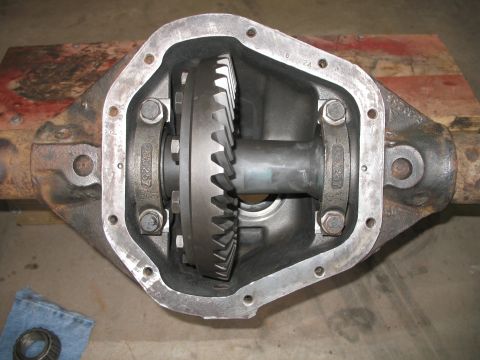 1985 Ford Bronco - Open differential housing with gears visible, part number 330257 stamped on bearing caps.
