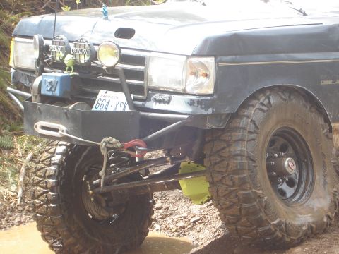 1989 Ford Bronco - This modified truck features a winch and extra lights, suggesting off-road use.