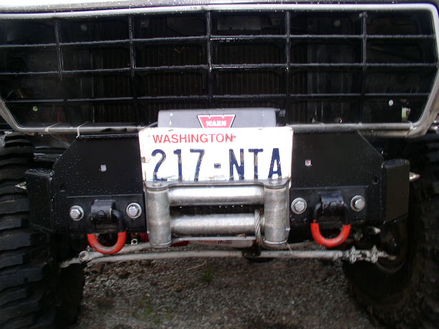Front bumper with winch, red tow hooks, and Washington license plate 217-NTA