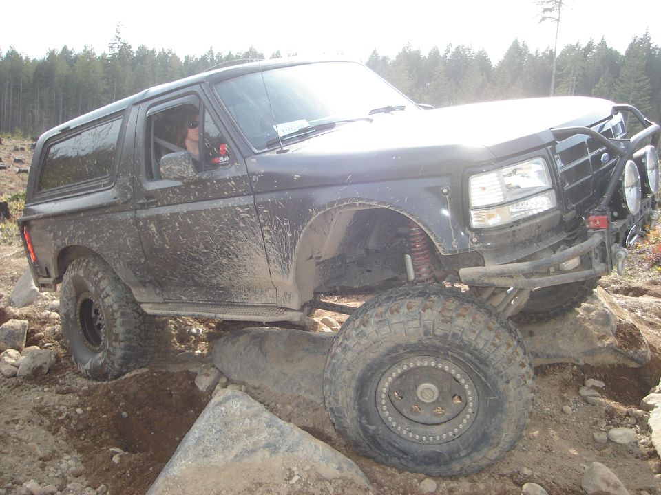 1989 Ford Bronco navigating rocky terrain