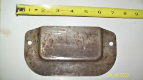 1972 Ford Ranchero - A rusted metal part, likely a cover or bracket, is shown with a tape measure for scale. Its exact purpose and vehicle origin are undetermin…