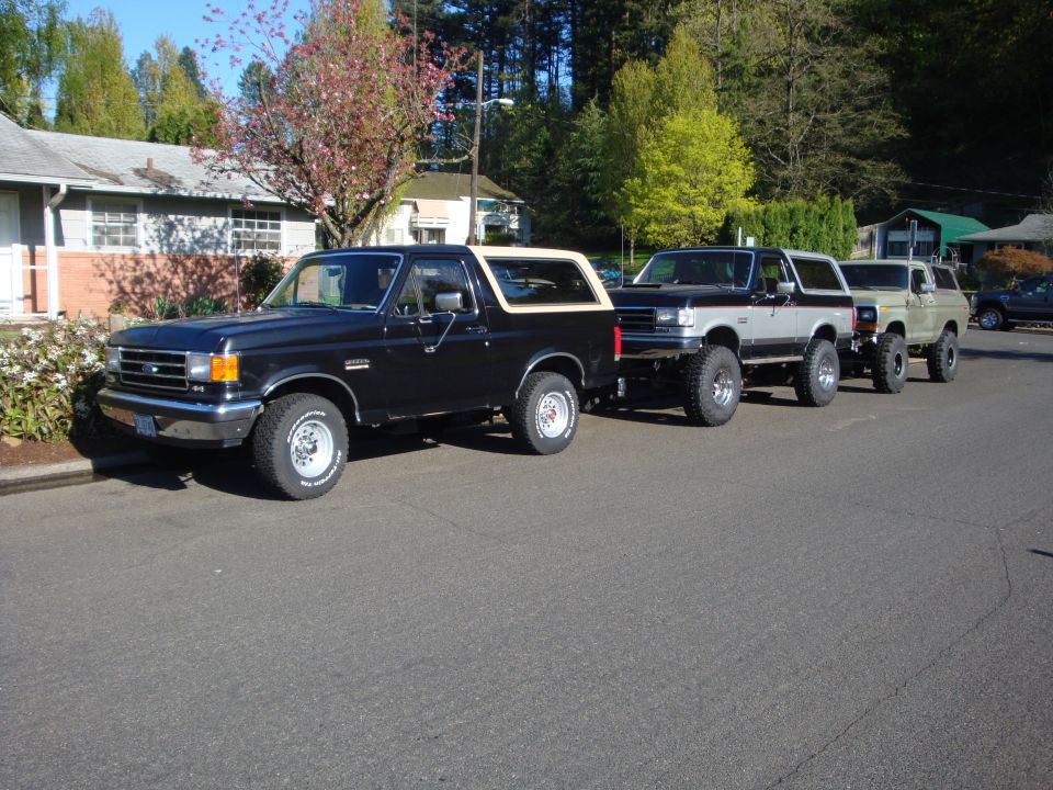 Black 1991 Ford Bronco parked curbside, front 3/4 view