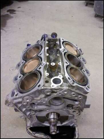 1994 Ford Probe - This V8 engine block shows the cylinder bores and crankshaft snout. The Supermotors.net watermark is visible.