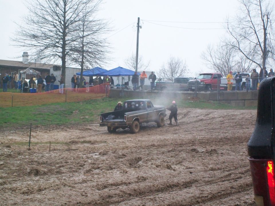 Brown 1979 Ford F-250 in mud, 3q-front view