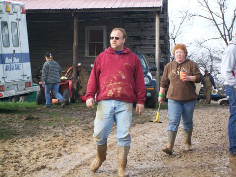 1979 Ford F-250 - Muddy conditions surround an ambulance and several people near a rustic building.