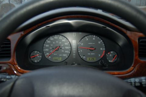2001 Ford Crown Victoria - Interior view of dashboard gauges with odometer reading 146011 and clock at 6:26.