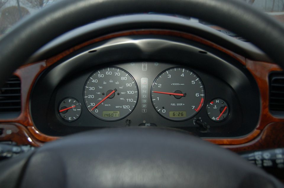 Dashboard gauges showing 146011 miles and 6:26 time