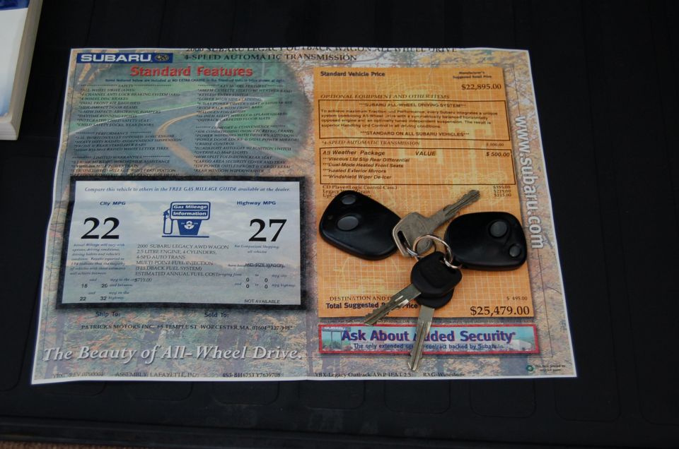 Subaru window sticker with standard features, MPG, and price, along with three keys and fobs