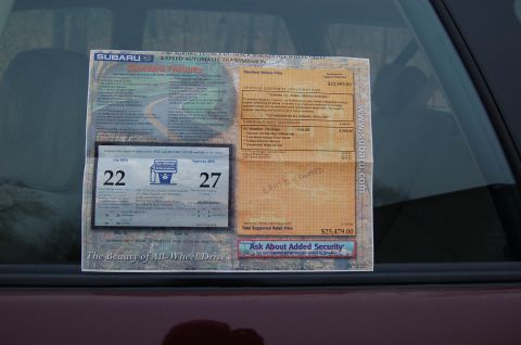 2001 Ford Crown Victoria - A Subaru window sticker displays standard features, pricing, and fuel economy ratings.