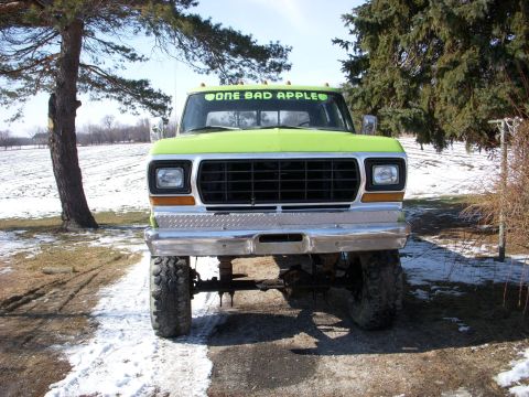 1974 Ford F-350 - This lifted pickup truck features a prominent grille and a windshield decal. The year is estimated based on the grille design.
