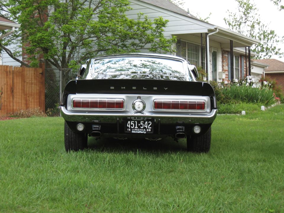 Black 1968 Shelby GT500 rear view with quad exhaust pipes and Virginia license plate
