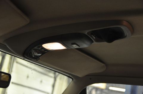 1996 Ford Bronco - Interior view of the overhead console and sun visor in a 1996 Ford Bronco.