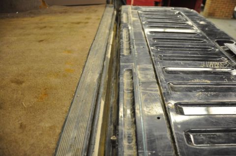 1996 Ford Bronco - Interior view of the tailgate and carpeted cargo area of a 1996 Ford Bronco.
