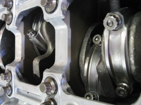 1994 Ford Probe - This image shows the internal components of an engine, specifically the crankshaft and connecting rods.