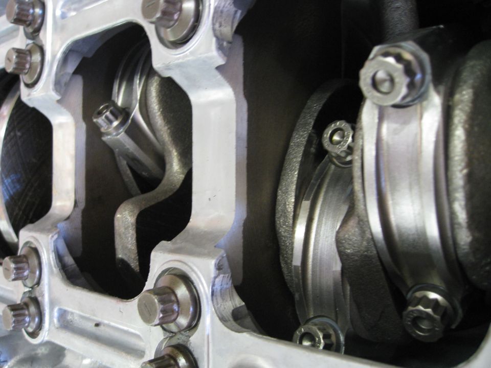 Close-up of engine crankshaft and connecting rods with bolts