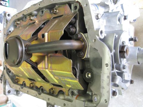 1994 Ford Probe - Close-up view of an engine's oil pump and pickup tube assembly.