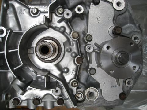 1994 Ford Probe - This image shows a detailed view of an engine part, likely a water pump housing, with visible casting numbers.