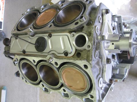 1994 Ford Probe - Close-up view of an engine block showing pistons within the cylinders.