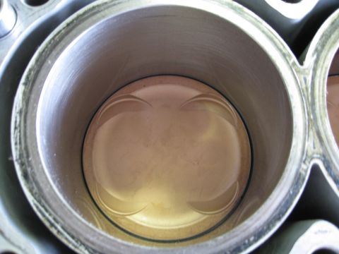 1994 Ford Probe - Close-up view of an engine cylinder and piston, revealing internal mechanical components.