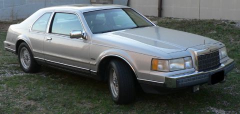 1990 Lincoln Mark VII - Silver 1990 Lincoln Mark VII coupe is parked on a grassy area.
