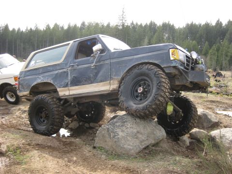 1979 Ford Bronco - Modified Ford Bronco navigating challenging terrain off-road.