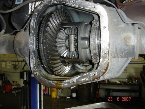 2007 Ford Mustang - Close-up view of an open differential housing, revealing internal gears and components.