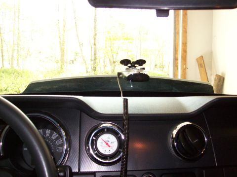 2007 Ford Mustang - Interior view of a 2007 Ford Mustang, showing the dashboard, speedometer, and an aftermarket gauge.