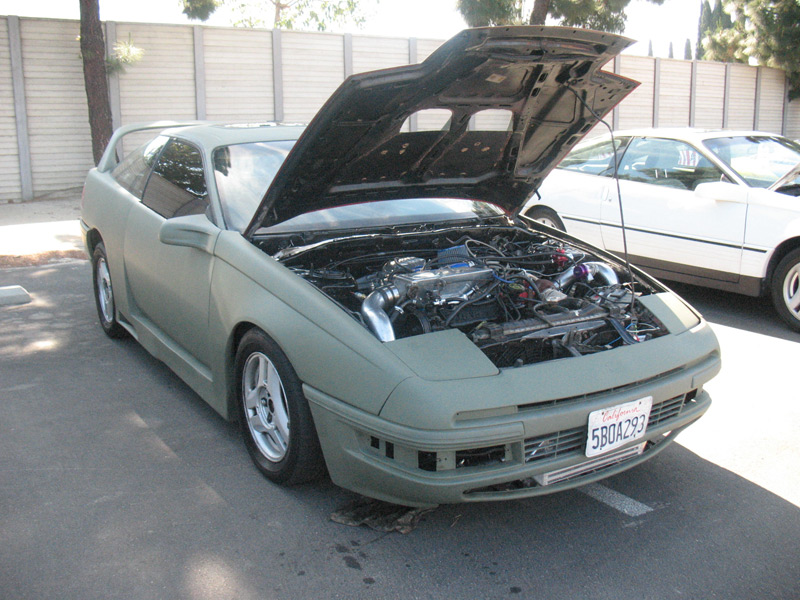 Primer-green body-kitted Ford Probe with hood open showing turbo, plate 5BOA293