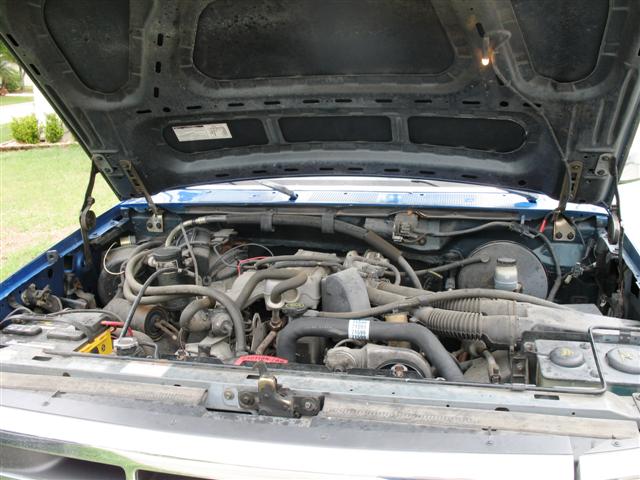Blue 1992 Ford Bronco engine bay with hood open