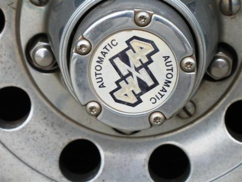 1992 Ford Bronco - Close-up of a wheel hub '4x4 Automatic' text.