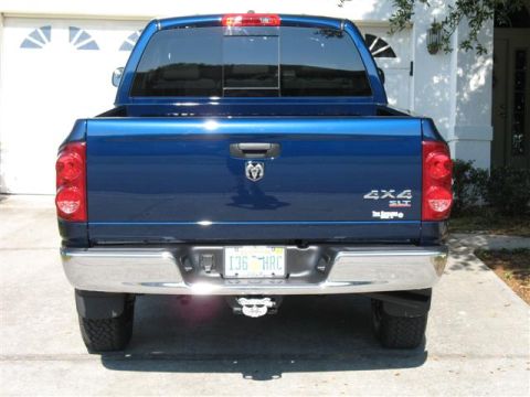 2008 Dodge 1500 - Blue 2008 Dodge 1500 pickup truck shown from the rear, 4x4 SLT badging.